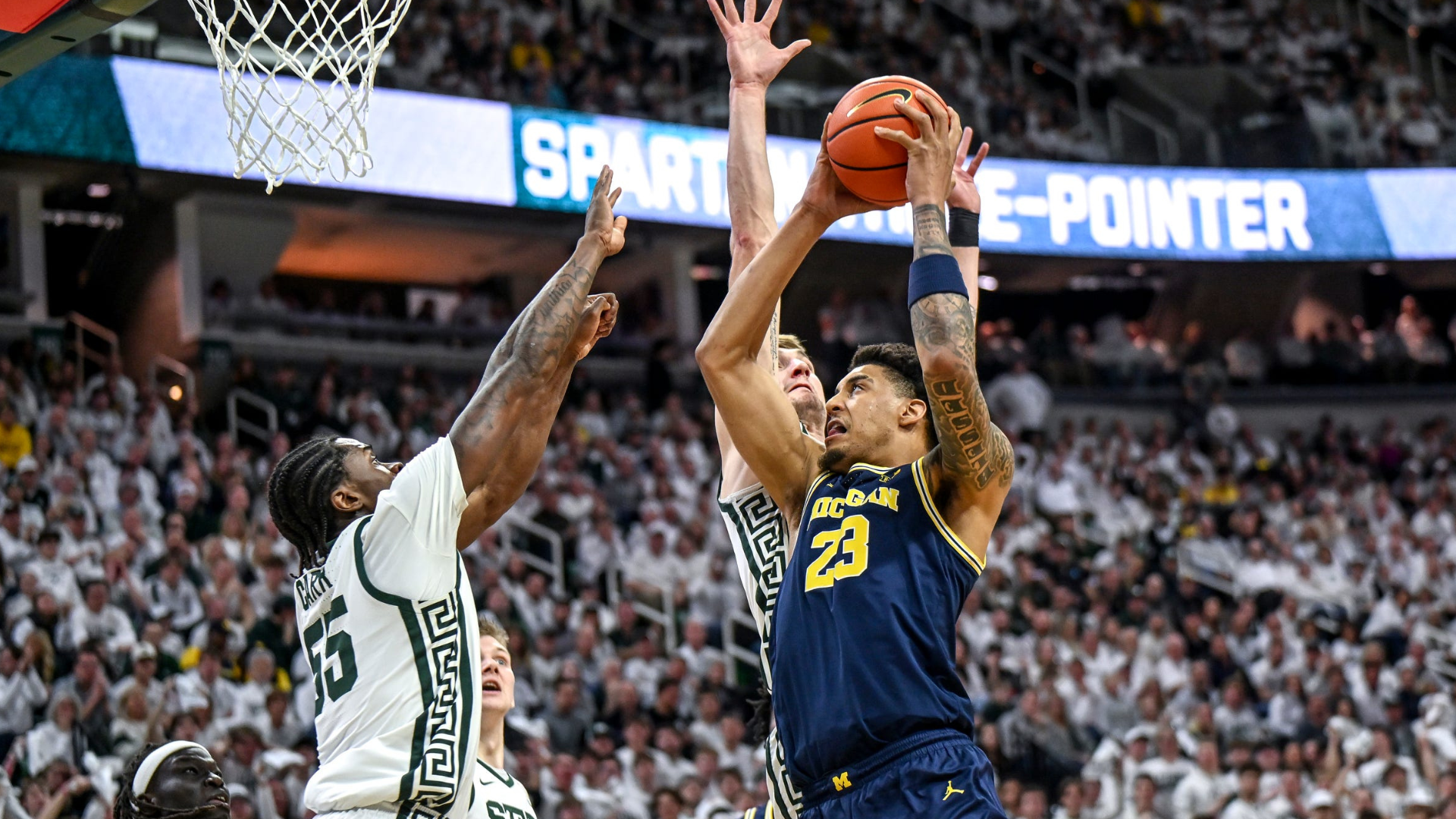 
                        Michigan uses big second-half rally to beat Michigan State for first time in Breslin Center since 2018
                    